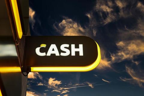What does a Bancontact CASH point look like and what services does it offer?